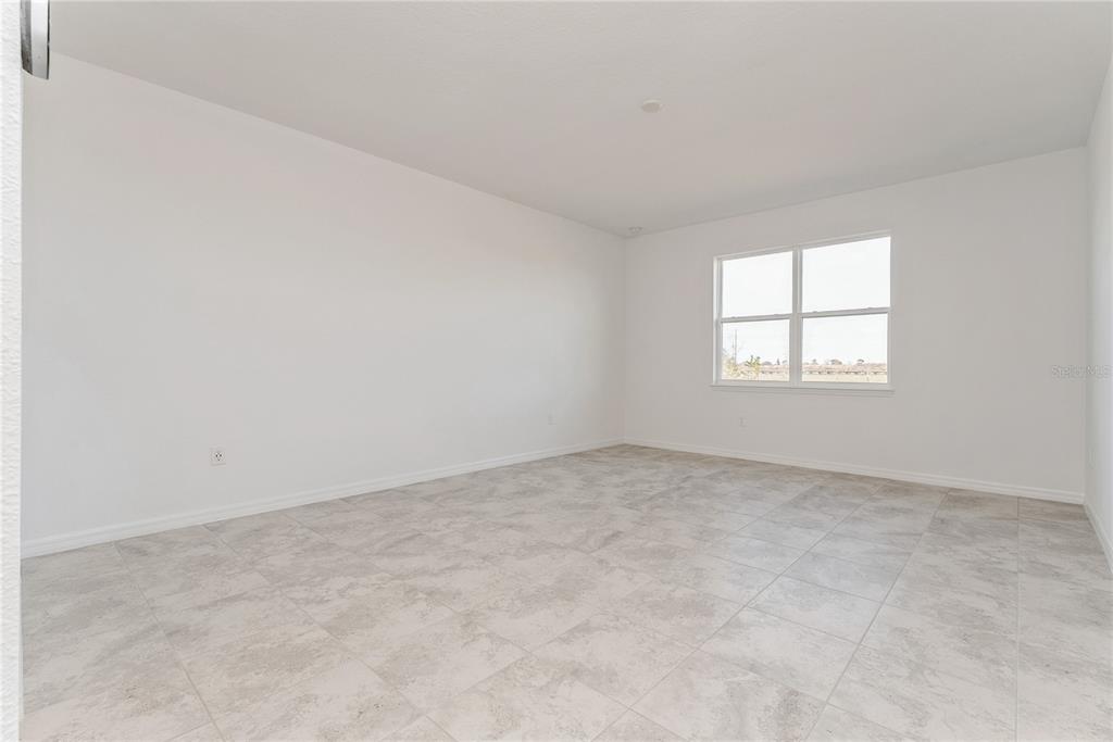 7405 Southwest 61st Street Ocala, FL 34474 - Photo 18 of 46 an empty room with windows