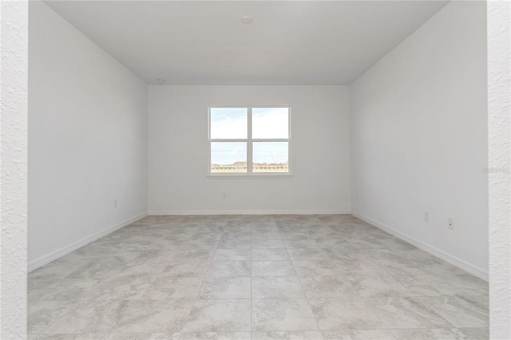 7405 Southwest 61st Street Ocala, FL 34474 - Photo 20 of 46 an empty room with a window