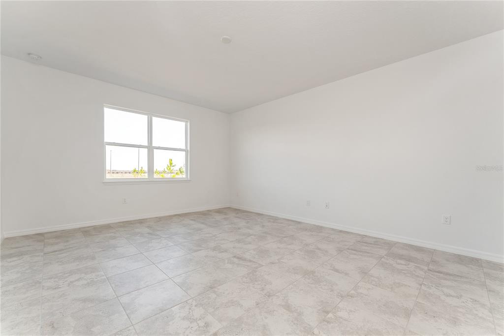 7405 Southwest 61st Street Ocala, FL 34474 - Photo 21 of 46 an empty room with a window