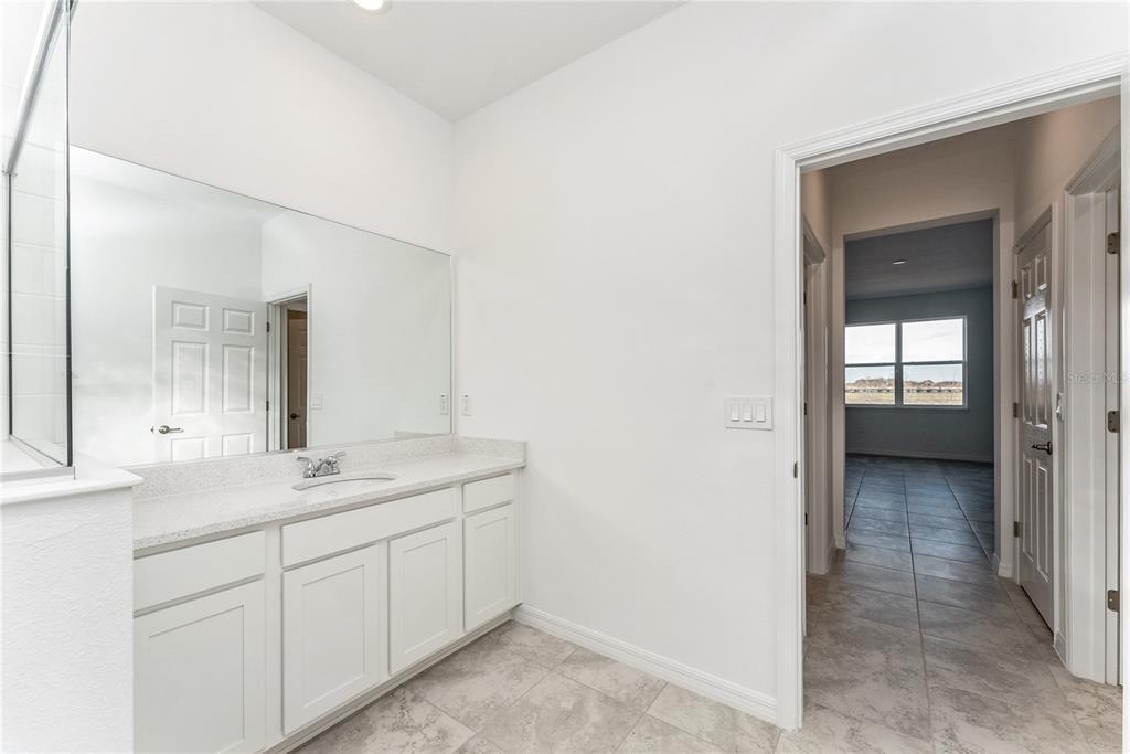 7405 Southwest 61st Street Ocala, FL 34474 - Photo 26 of 46 a bathroom with a sink and a mirror