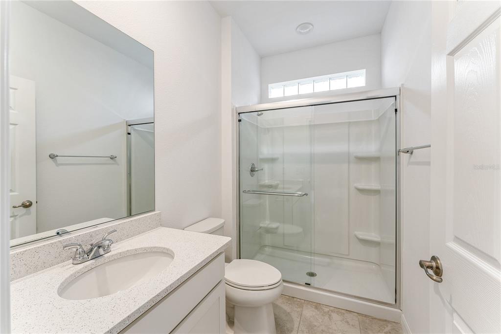 7405 Southwest 61st Street Ocala, FL 34474 - Photo 30 of 46 a bathroom with a sink toilet and shower