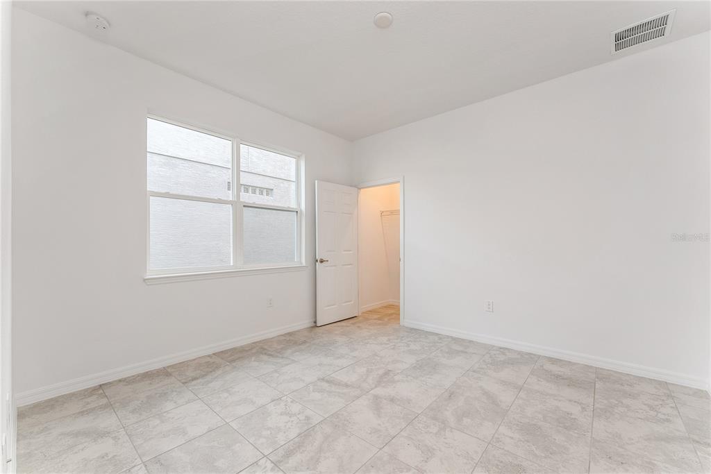 7405 Southwest 61st Street Ocala, FL 34474 - Photo 31 of 46 an empty room with windows