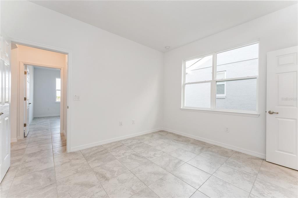 7405 Southwest 61st Street Ocala, FL 34474 - Photo 32 of 46 an empty room with windows and closet