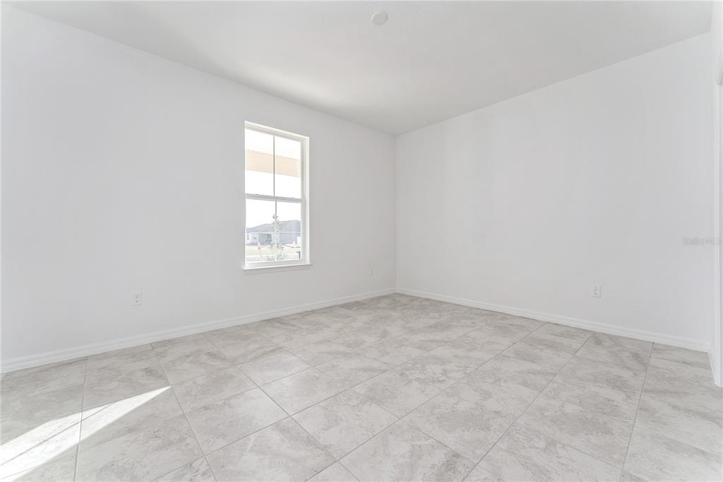 7405 Southwest 61st Street Ocala, FL 34474 - Photo 35 of 46 an empty room with windows