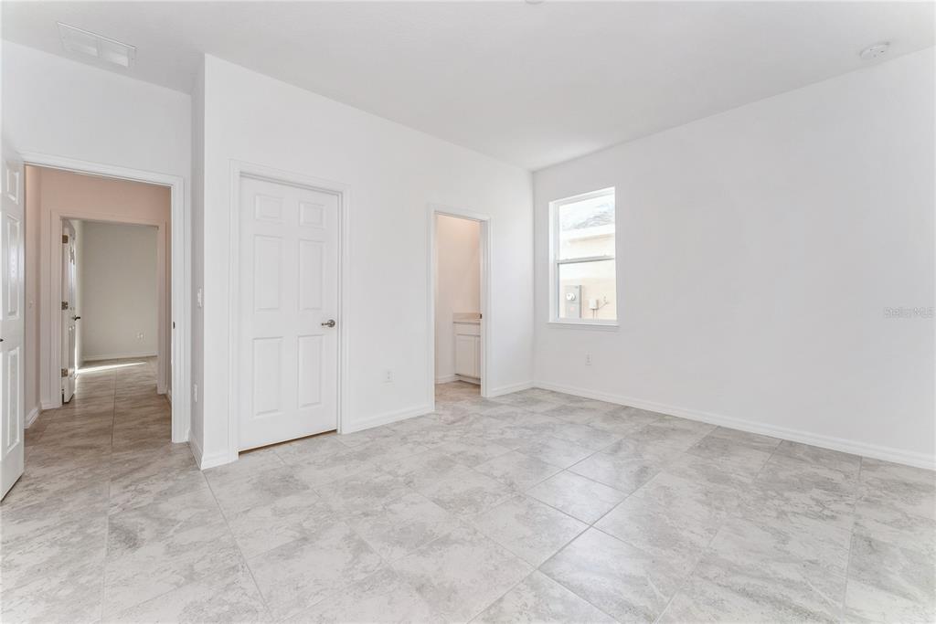 7405 Southwest 61st Street Ocala, FL 34474 - Photo 39 of 46 an empty room with windows and closet