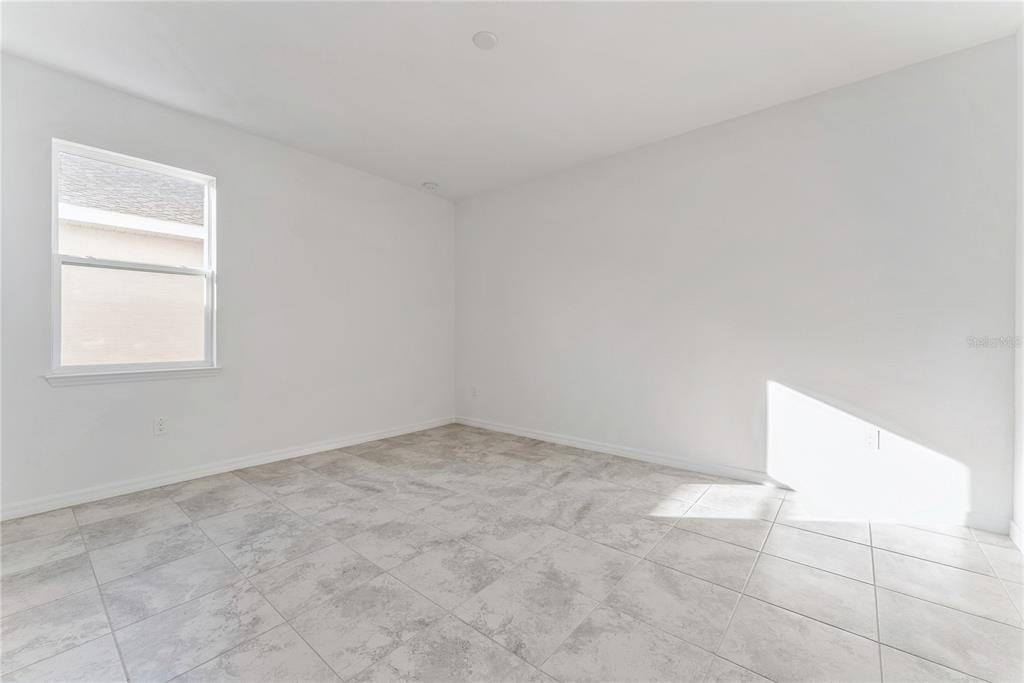 7405 Southwest 61st Street Ocala, FL 34474 - Photo 40 of 46 an empty room with windows