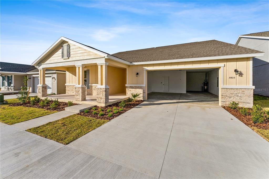 7405 Southwest 61st Street Ocala, FL 34474 - Photo 4 of 46 a front view of a house with yard