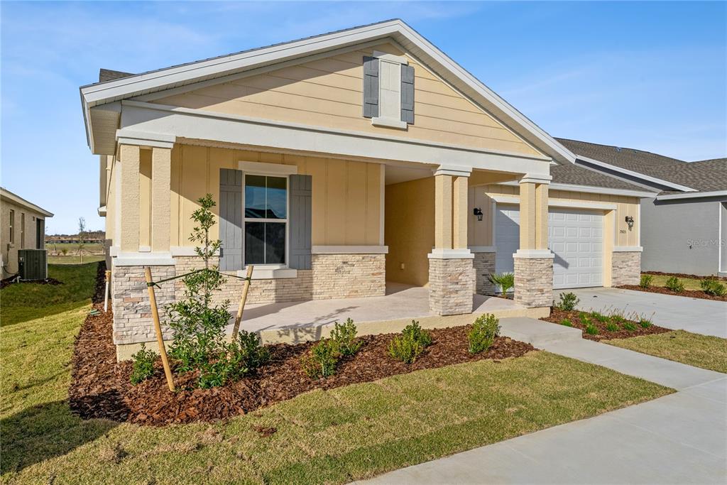 7405 Southwest 61st Street Ocala, FL 34474 - Photo 43 of 46 a front view of a house with garden
