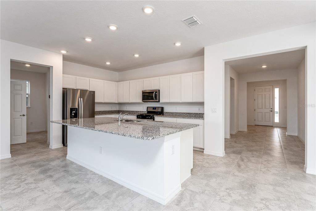 7405 Southwest 61st Street Ocala, FL 34474 - Photo 10 of 46 a large kitchen with stainless steel appliances lots of counter top space
