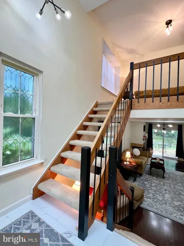 a room with lots of windows and furniture