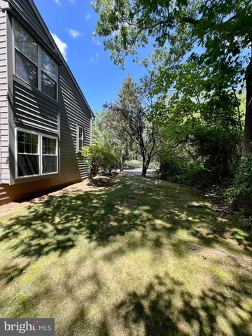 a view of a house with a tree