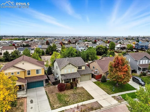 an aerial view of a house with a garden