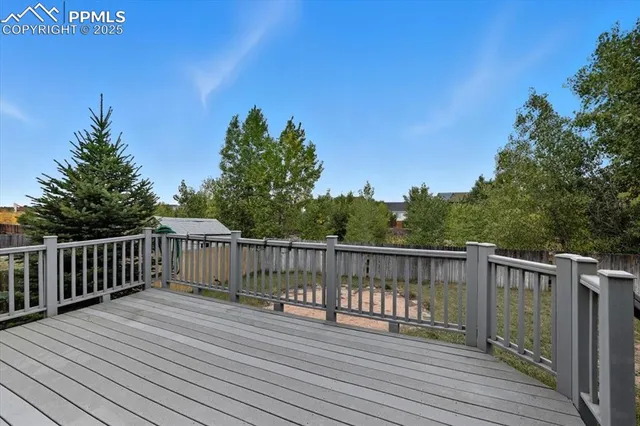 a view of deck with wooden floor and fence