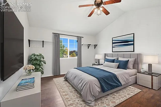 a bedroom with a bed and a couch