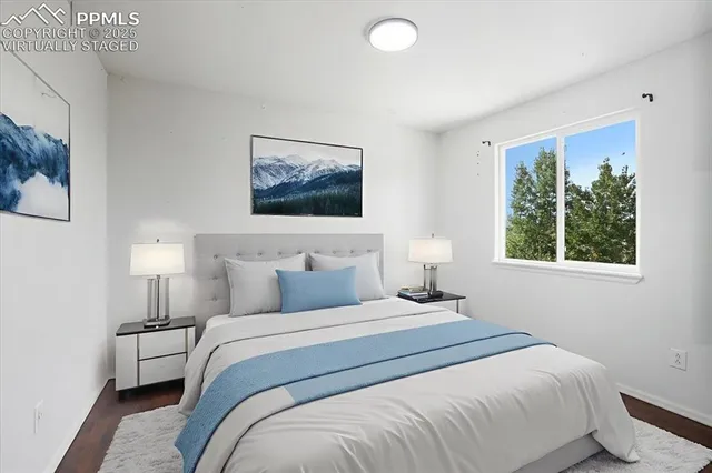 a bedroom with a large bed and a window