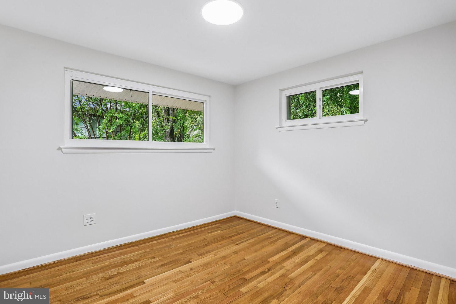 907 Hoyt Street Silver Spring, MD 20902 - Photo 34 of 69 a view of empty room with wooden floor and fan