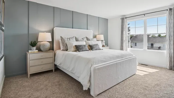 a bedroom with bed and window