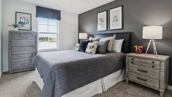 a bedroom with a bed and a closet