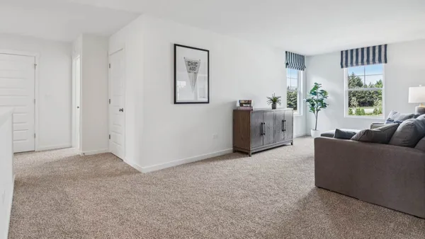a living room with furniture and window