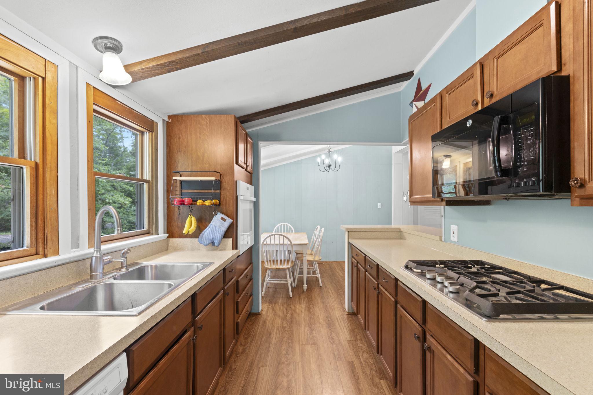 9448 Green Road Midland, VA 22728 - Photo 37 of 91 a kitchen with stainless steel appliances granite countertop a sink stove and cabinets
