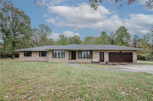 a house with trees in the background