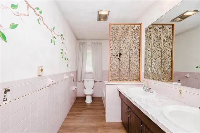 a bathroom with a sink a toilet and a bathtub