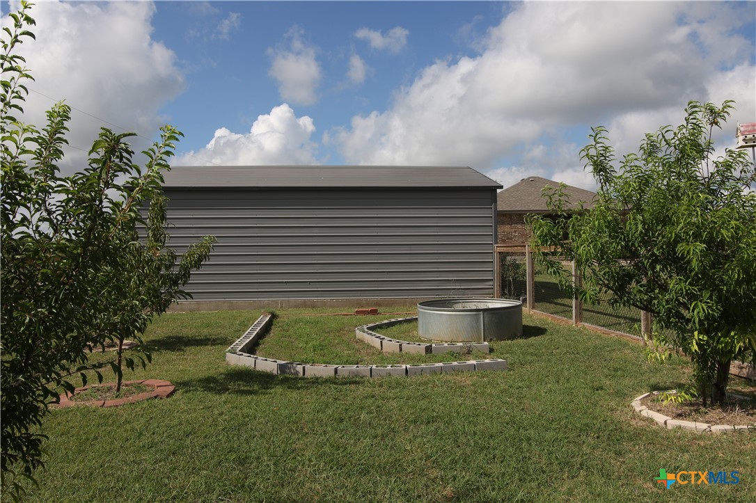 2734 Rock Road Troy, TX 76579 - Photo 38 of 47 Fruit Trees Behind Metal Building