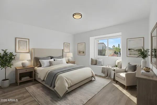 a bedroom with a bed and a couch