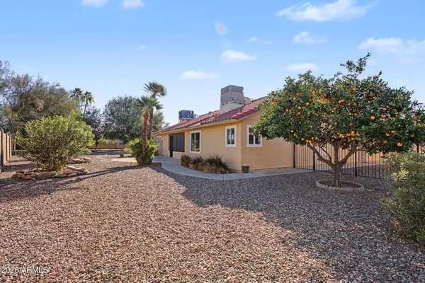 a view of a house with a backyard