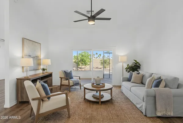 a living room with furniture and a large window