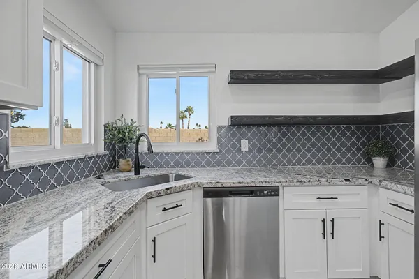 a kitchen with a sink and a window