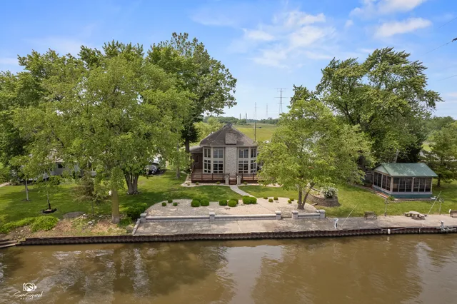a house with river in front of it