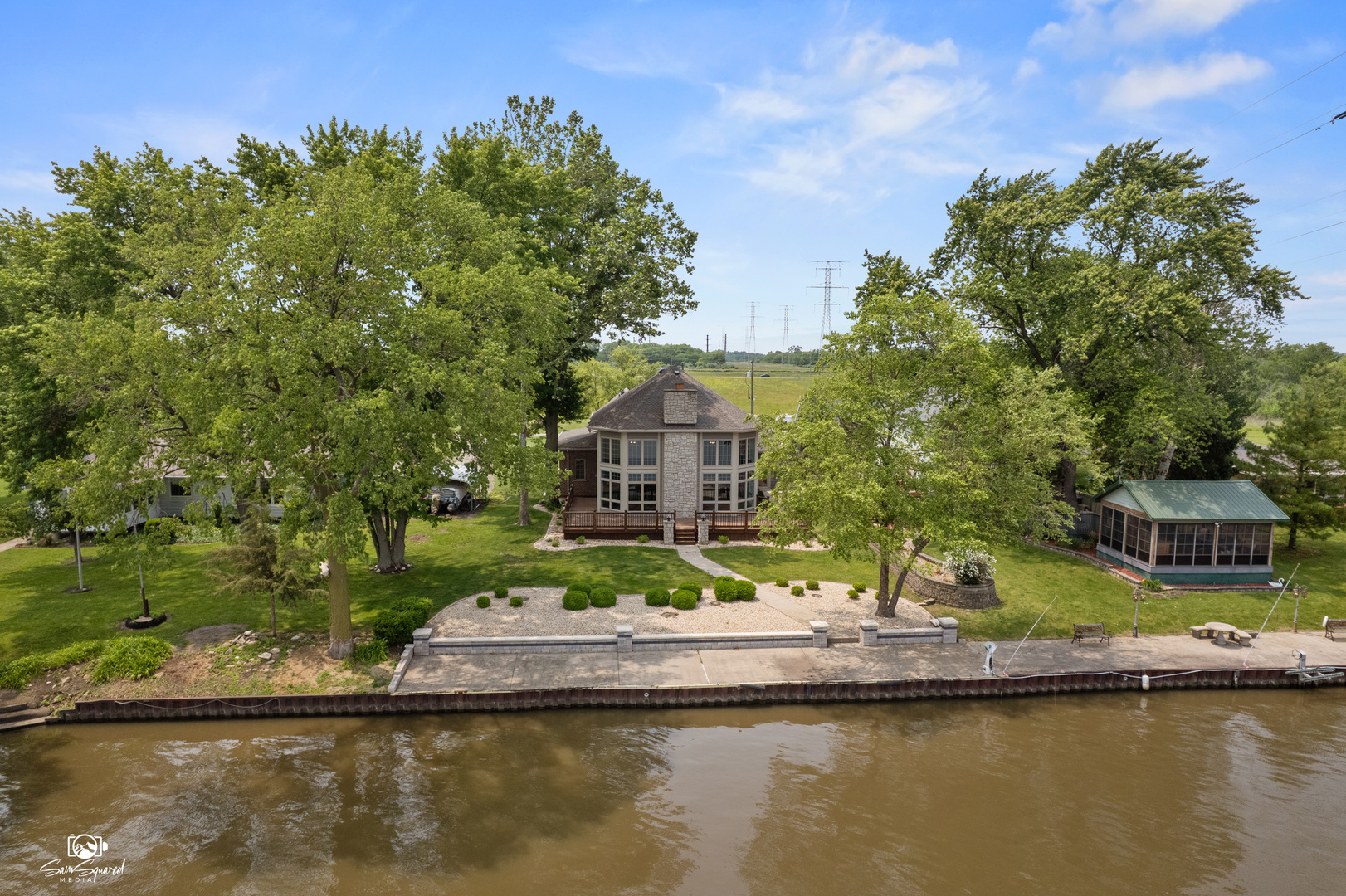a house with river in front of it
