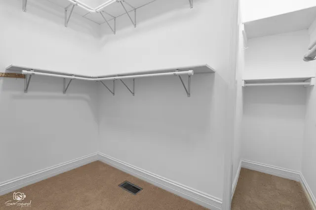 a view of an empty walk in closet