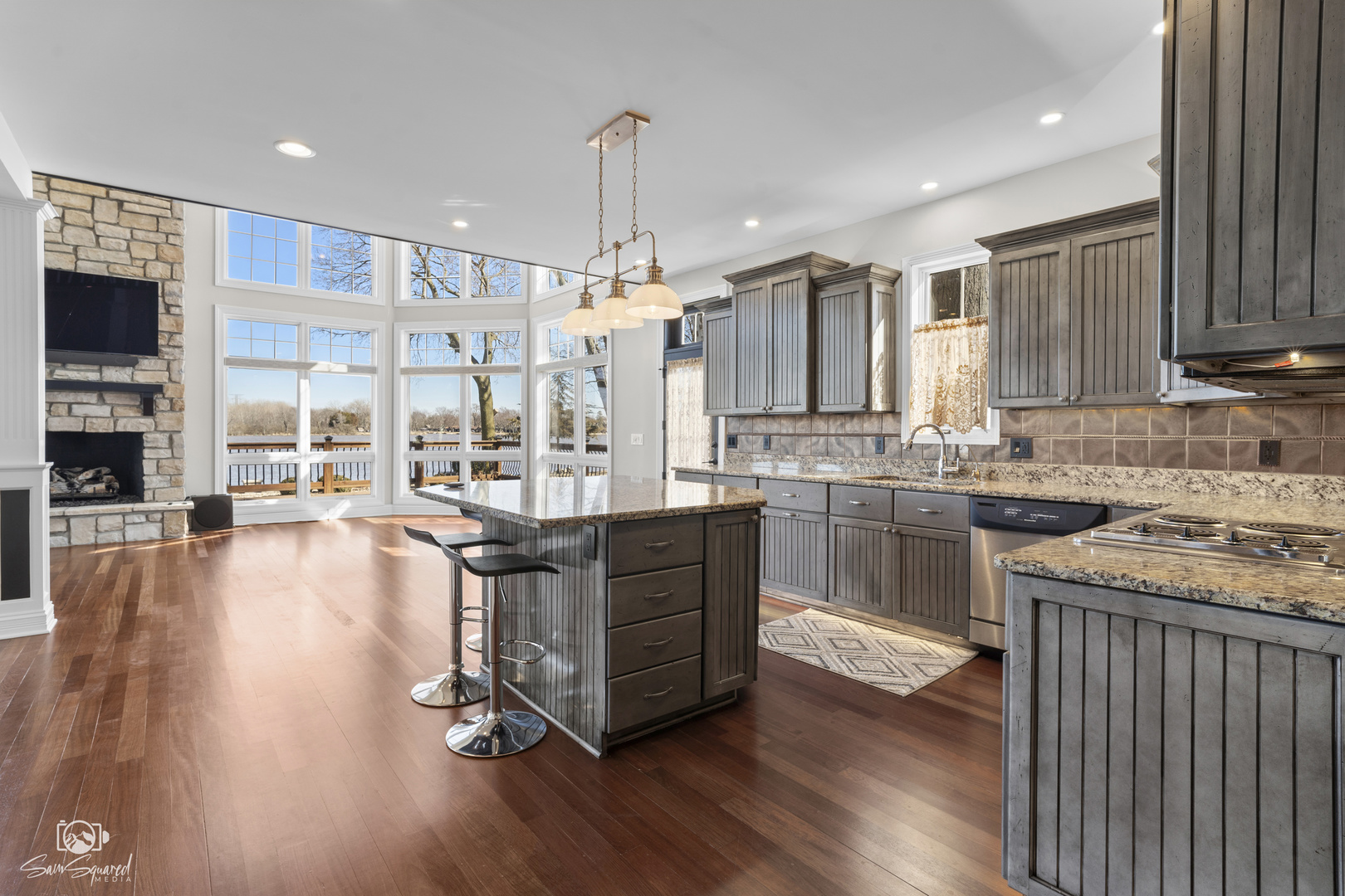 8043 Tamarack Lane Morris, IL 60450 - Photo 23 of 55 a kitchen with stainless steel appliances granite countertop a stove top oven a sink with wooden floors and cabinets