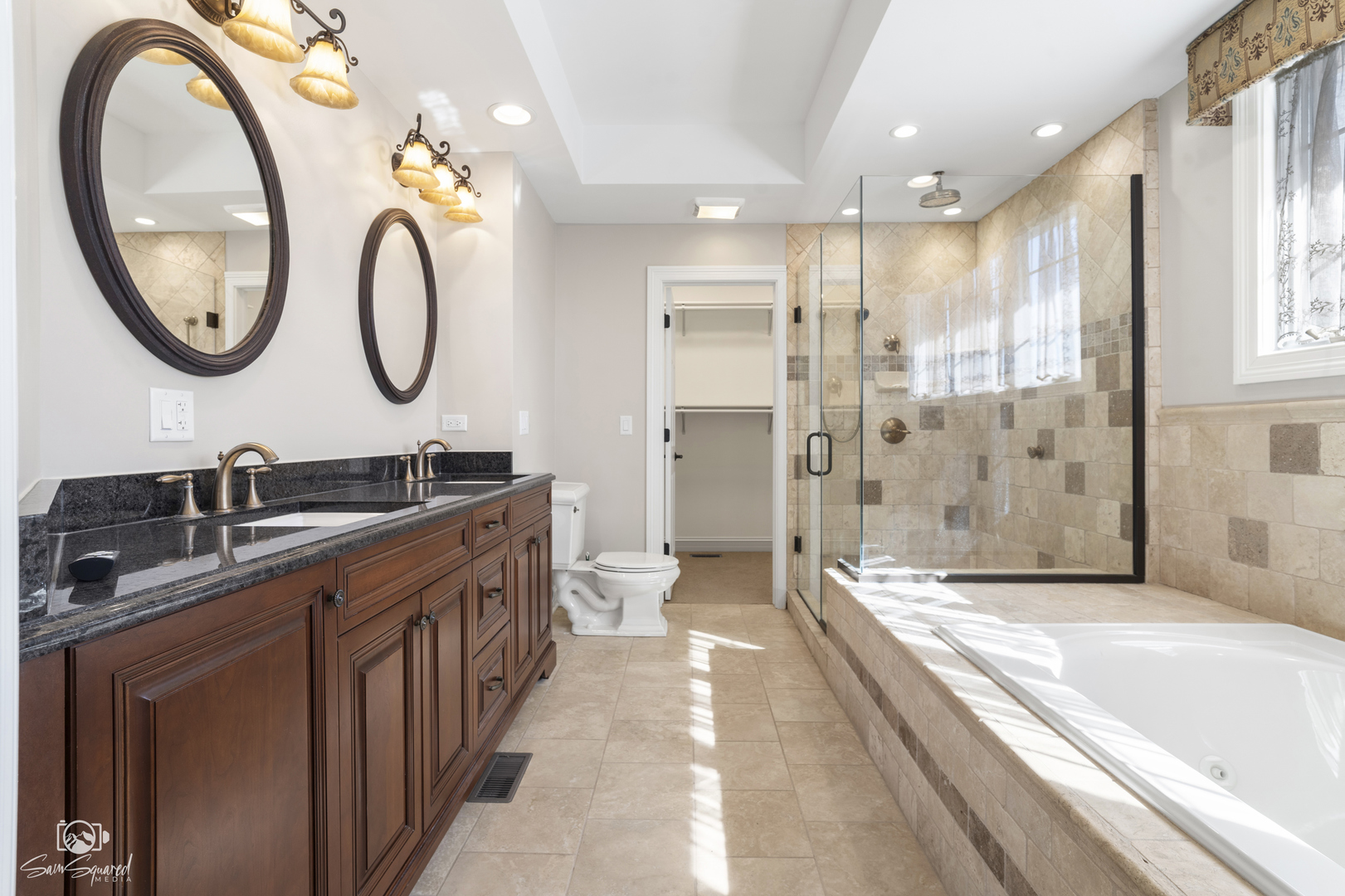 8043 Tamarack Lane Morris, IL 60450 - Photo 29 of 55 a spacious bathroom with a sink a mirror a bathtub and a shower