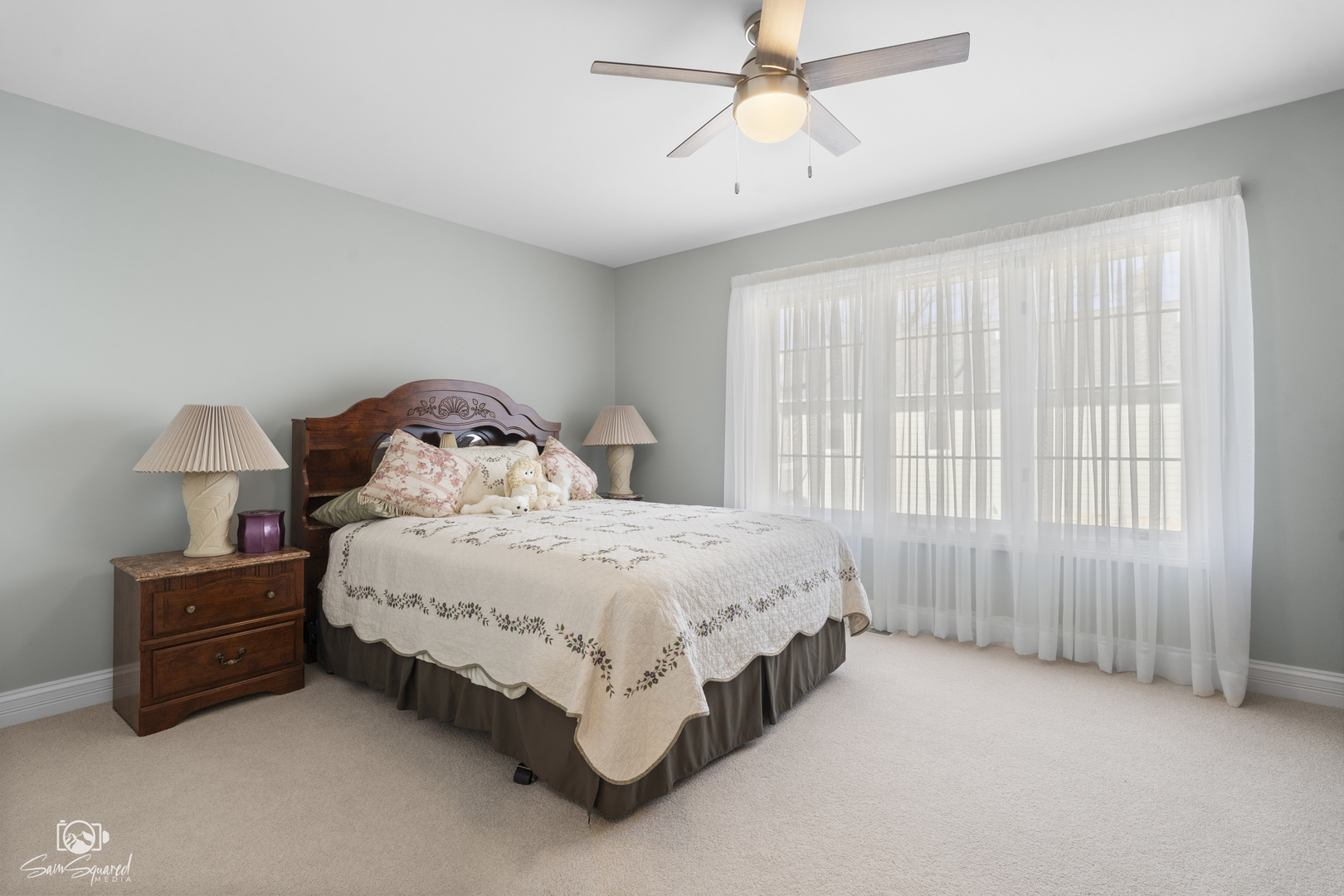 8043 Tamarack Lane Morris, IL 60450 - Photo 32 of 55 a spacious bedroom with a bed and a chandelier