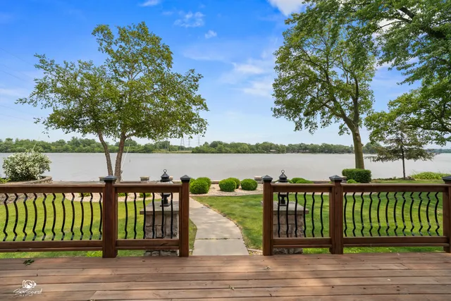 a view of wooden deck and lake