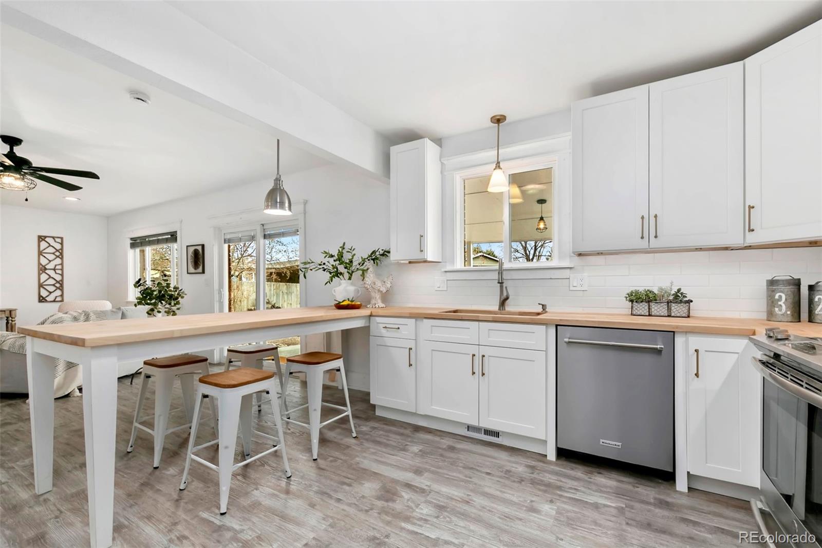 924 Teal Drive Fort Collins, CO 80521 - Photo 12 of 32 a kitchen with a sink and cabinets