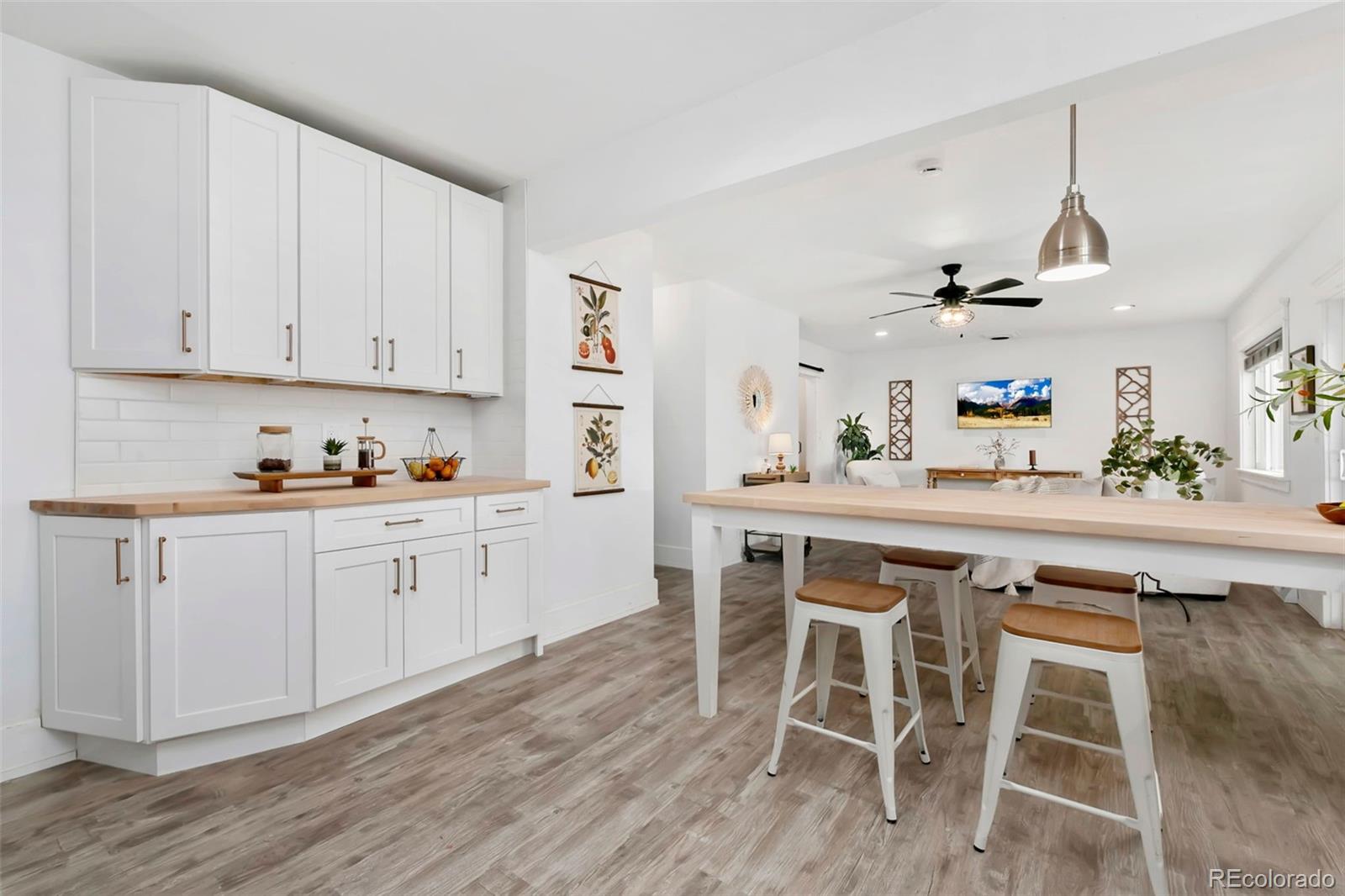 924 Teal Drive Fort Collins, CO 80521 - Photo 13 of 32 a kitchen with a table and chairs in it