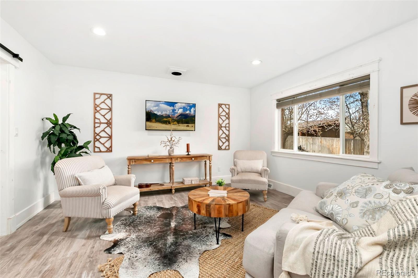 924 Teal Drive Fort Collins, CO 80521 - Photo 14 of 32 a living room with furniture and a large window