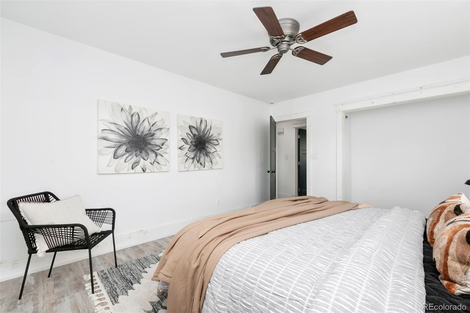 924 Teal Drive Fort Collins, CO 80521 - Photo 17 of 32 a bedroom with a bed and a chair