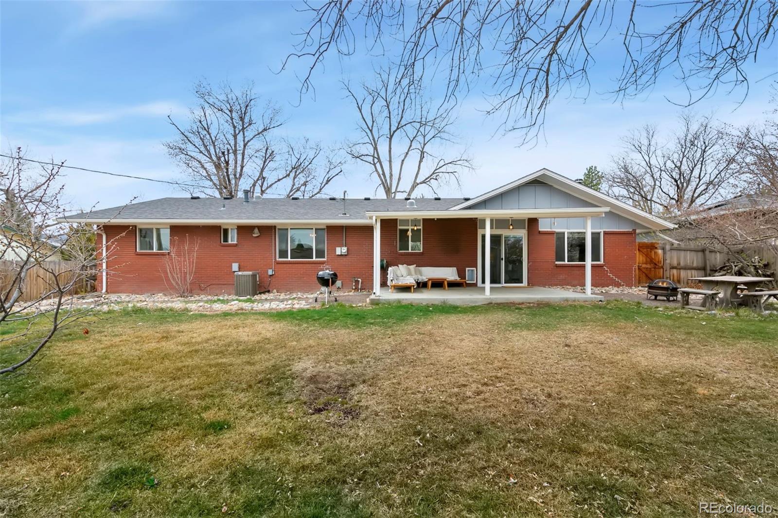924 Teal Drive Fort Collins, CO 80521 - Photo 26 of 32 a front view of a house with a garden