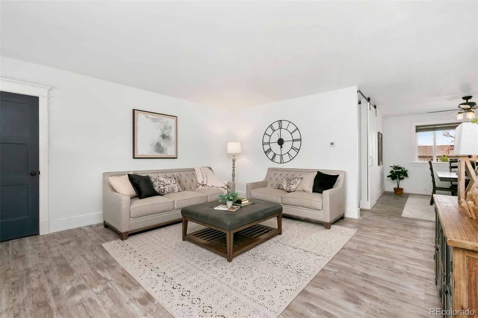 924 Teal Drive Fort Collins, CO 80521 - Photo 6 of 32 a living room with furniture and a table