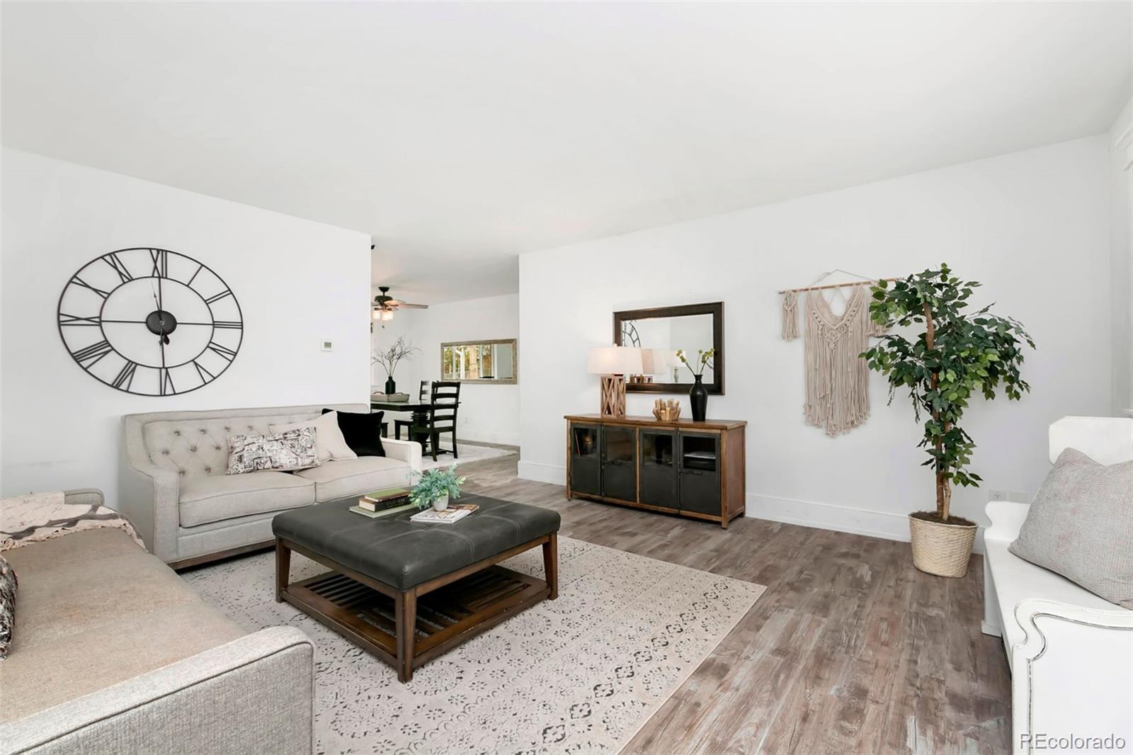 924 Teal Drive Fort Collins, CO 80521 - Photo 7 of 32 a living room with furniture and a potted plant