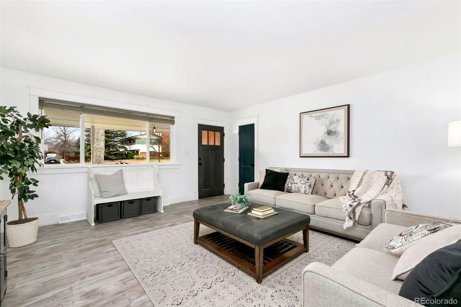 924 Teal Drive Fort Collins, CO 80521 - Photo 8 of 32 a living room with furniture and a large window