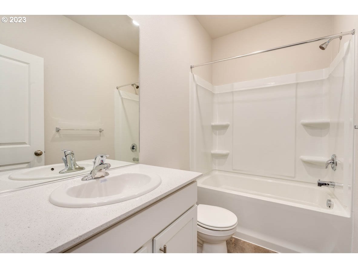 2686 Fenya Street Springfield, OR 97477 - Photo 16 of 20 a bathroom with a sink toilet vanity and shower