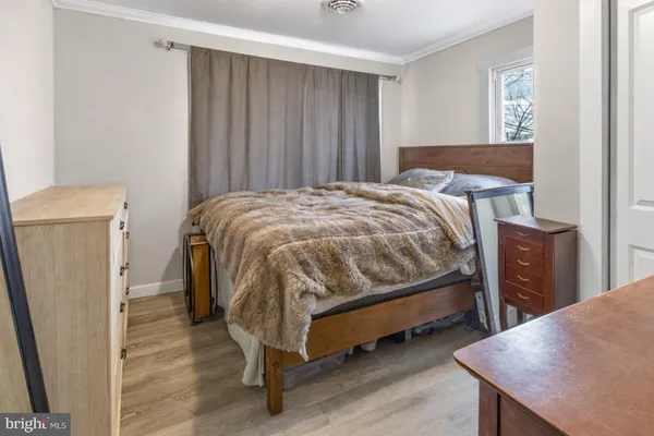 a bedroom with a bed and a table