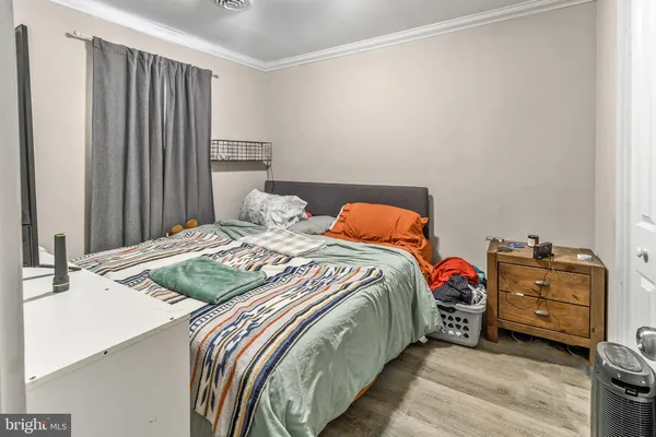 a bedroom with a bed and a closet