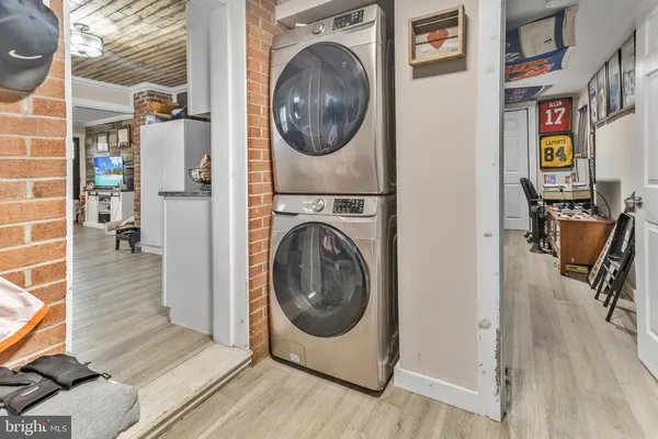 a view of a hallway with washer and dryer